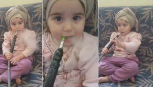 طفلة تدخن الشيشة باحترافية وأمها تصورها